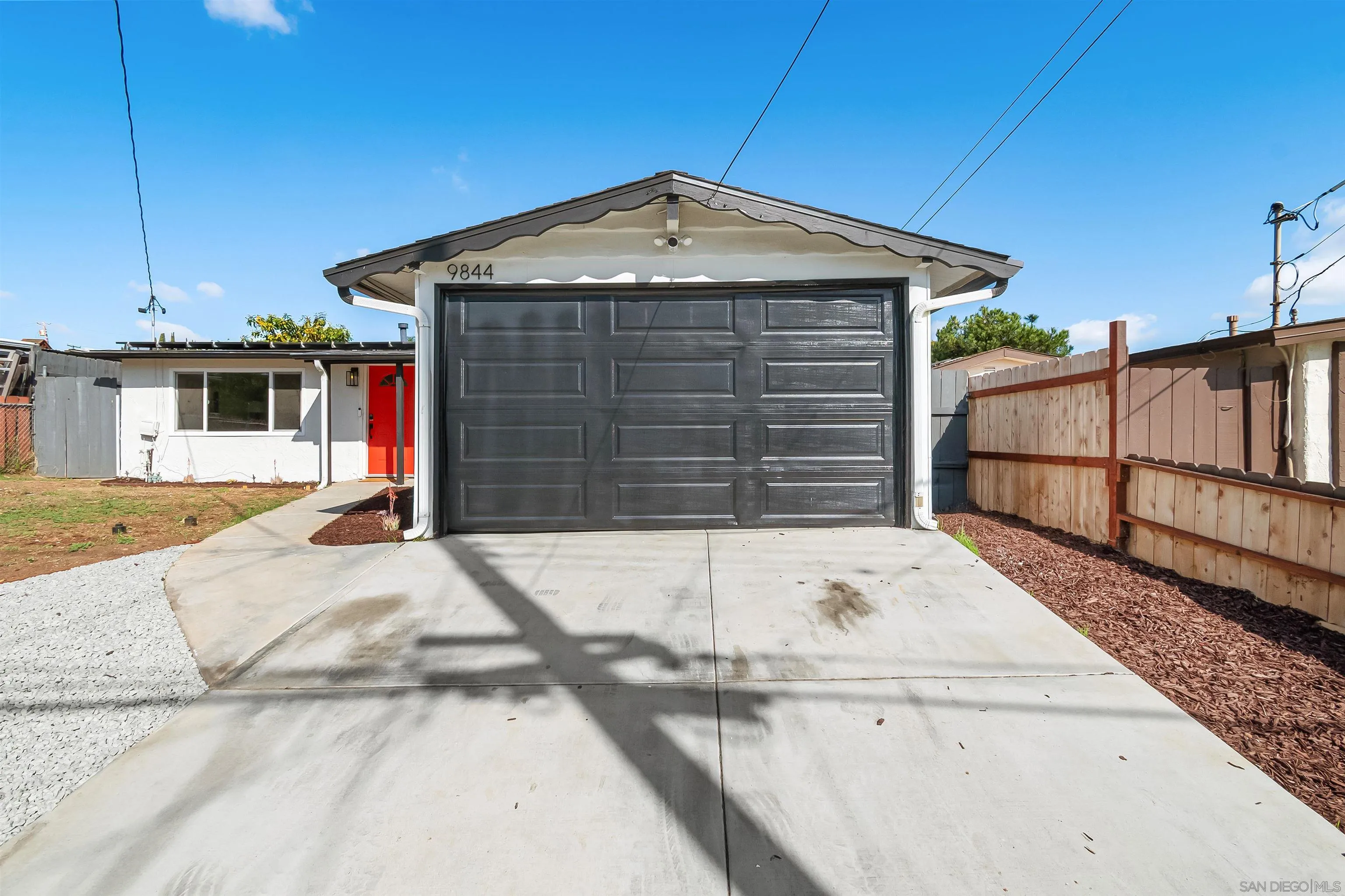 9844 Arapaho Street Spring Valley, CA 91977 - Photo 28 of 29 a front view of a house with a garage