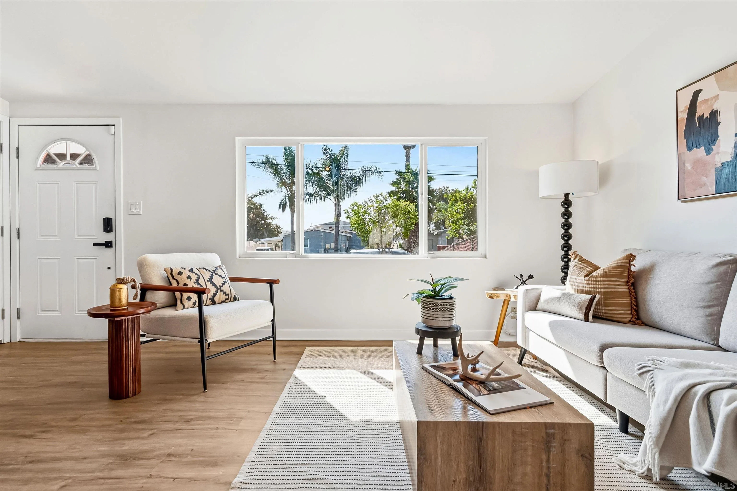 9844 Arapaho Street Spring Valley, CA 91977 - Photo 3 of 29 a living room with furniture and a large window