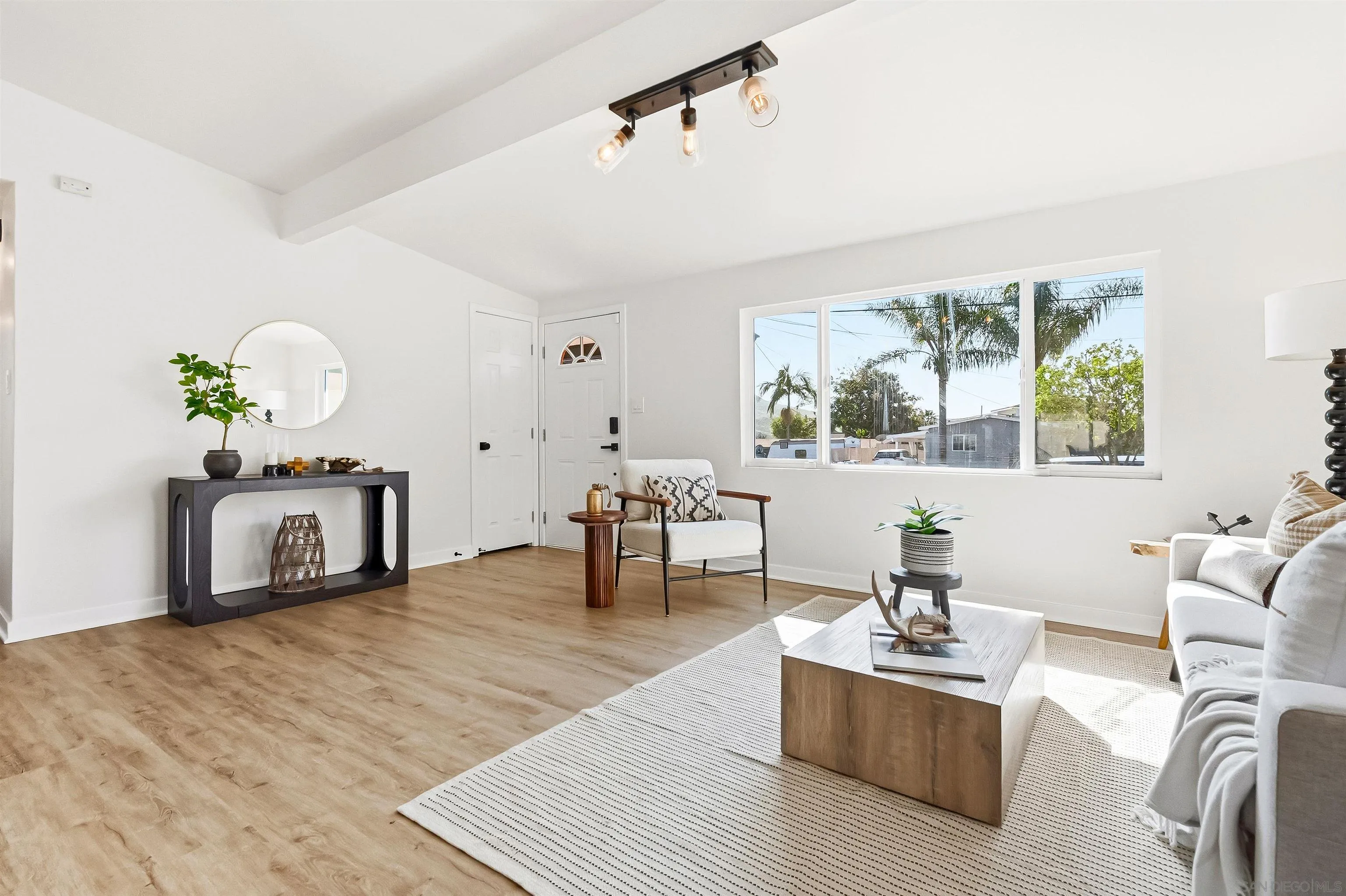 9844 Arapaho Street Spring Valley, CA 91977 - Photo 4 of 29 a living room with furniture and a fireplace