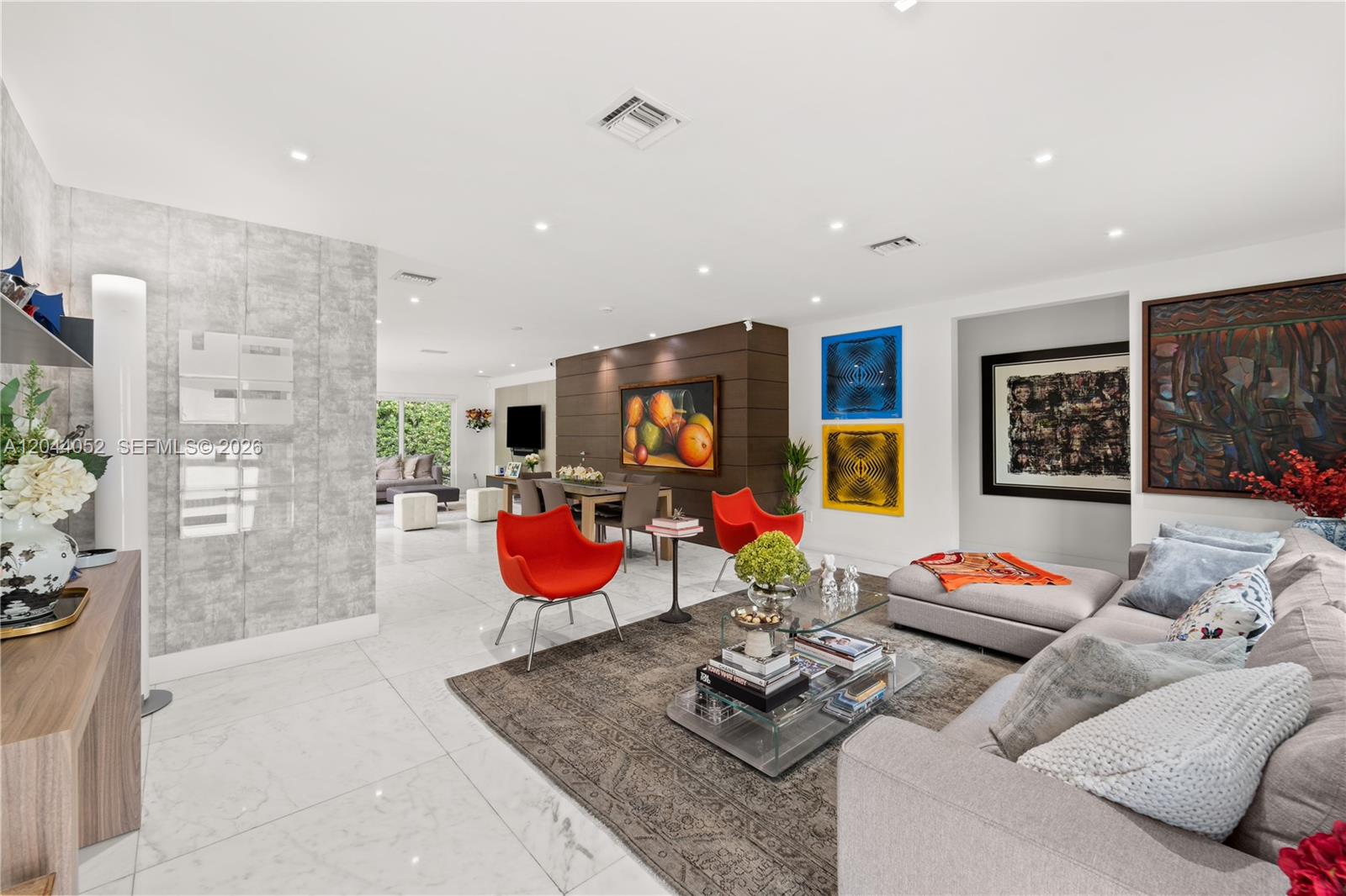 721 Bird Road Coral Gables, FL 33146 - Photo 1 of 24 a living room with furniture and a flat screen tv