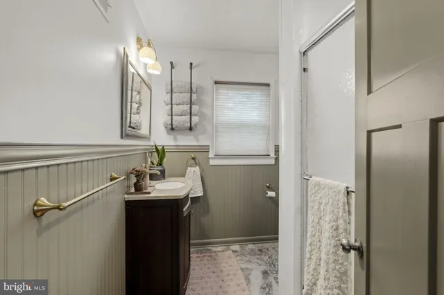 a bathroom with a sink and mirror