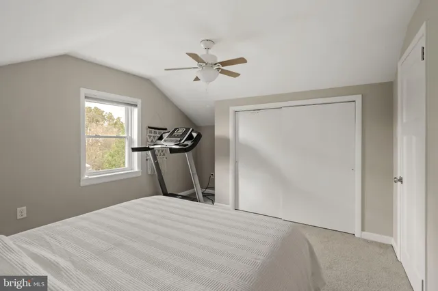 a view of a room with a table and chairs