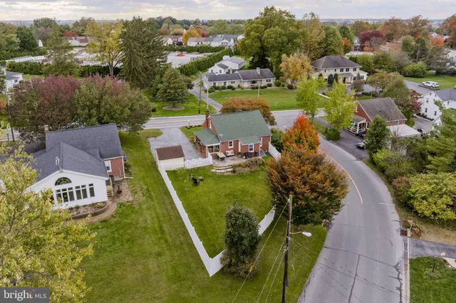 an aerial view of a house with a garden