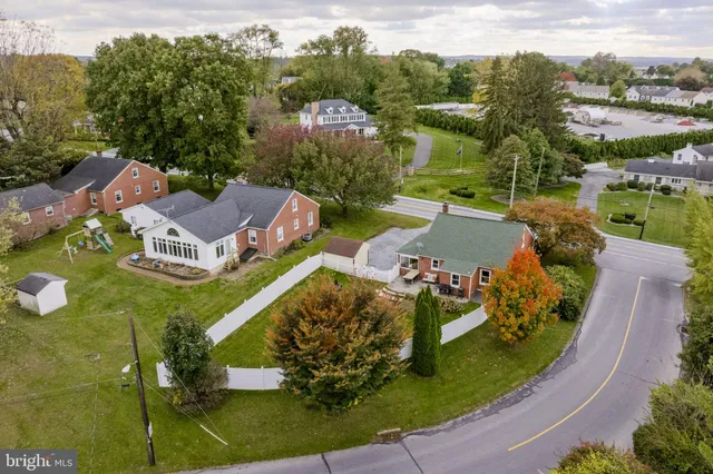 an aerial view of a house with a garden
