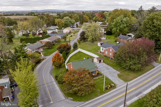 an aerial view of a house with a lake view