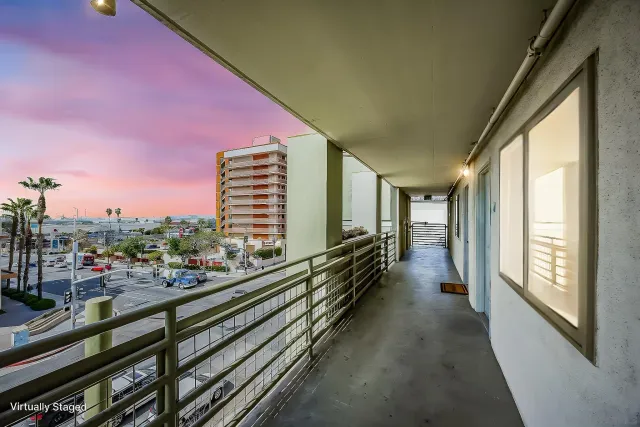 a view of a balcony with chairs