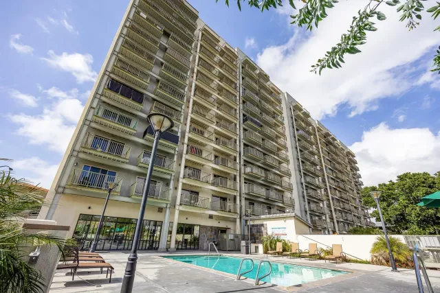 a view of a building with a backyard