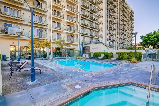 a view of a room with wooden floor and windows