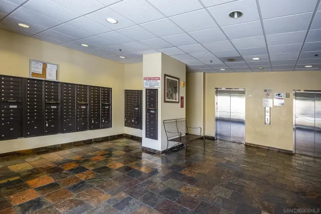 a large white kitchen with cabinets a stove a sink and a refrigerator