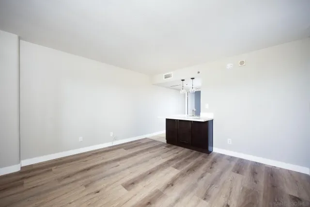 a view of workspace with wooden floor