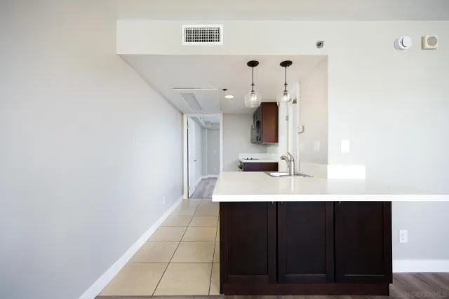 a en suite bathroom with a sink and a mirror