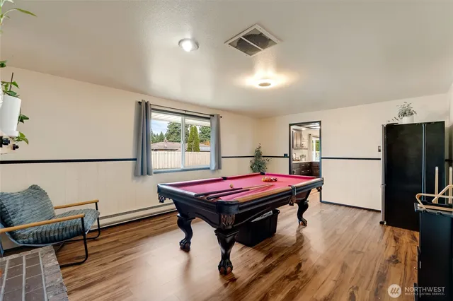 a spacious bedroom with a bed and a desk