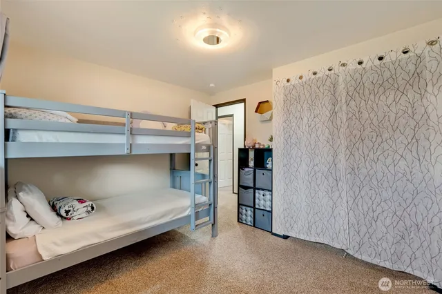 a view of a backyard with swimming pool