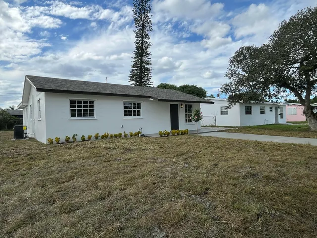 a house with trees in the background