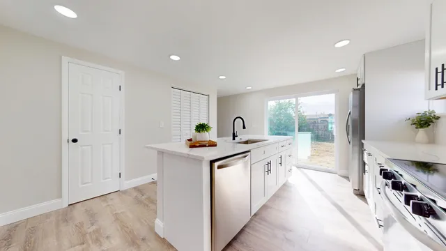a kitchen with counter top space and sink