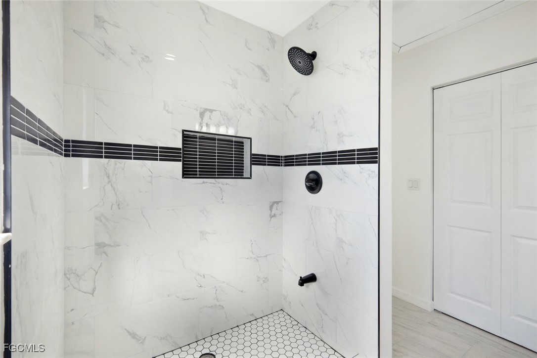 2519 Southwest 30th Street Cape Coral, FL 33914 - Photo 15 of 23 a bathroom with a shower