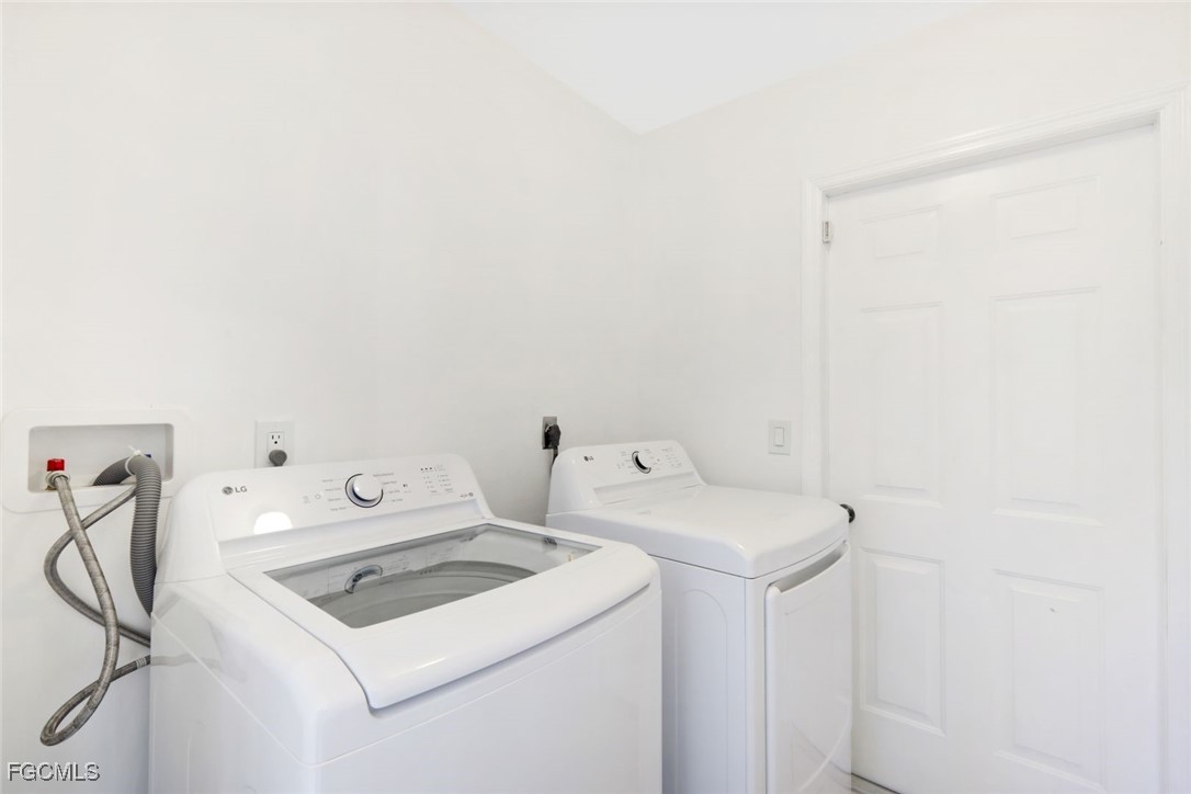 2519 Southwest 30th Street Cape Coral, FL 33914 - Photo 19 of 23 a utility room with dryer and washer