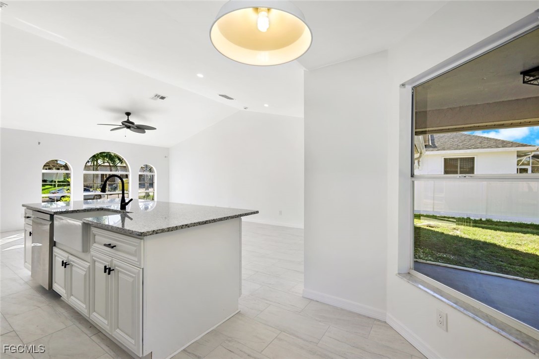 2519 Southwest 30th Street Cape Coral, FL 33914 - Photo 10 of 23 a kitchen with a sink and cabinets