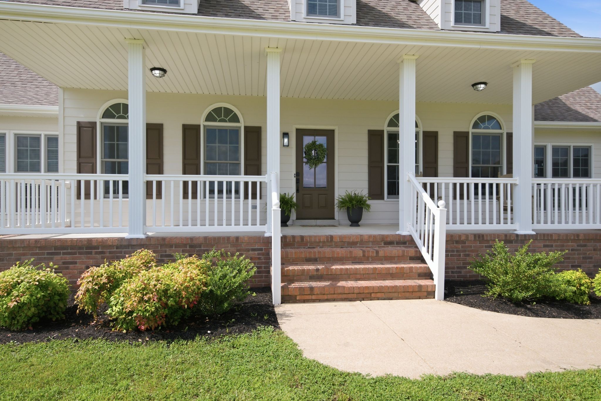 8167 Primm Springs Road Primm Springs, TN 38476 - Photo 10 of 65 a front view of a house with a garden