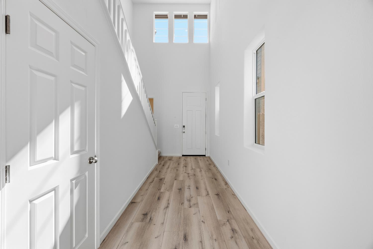 4401 Canyon Coral Way Rancho Cordova, CA 95742 - Photo 3 of 23 a view of a hallway with wooden floor and entryway