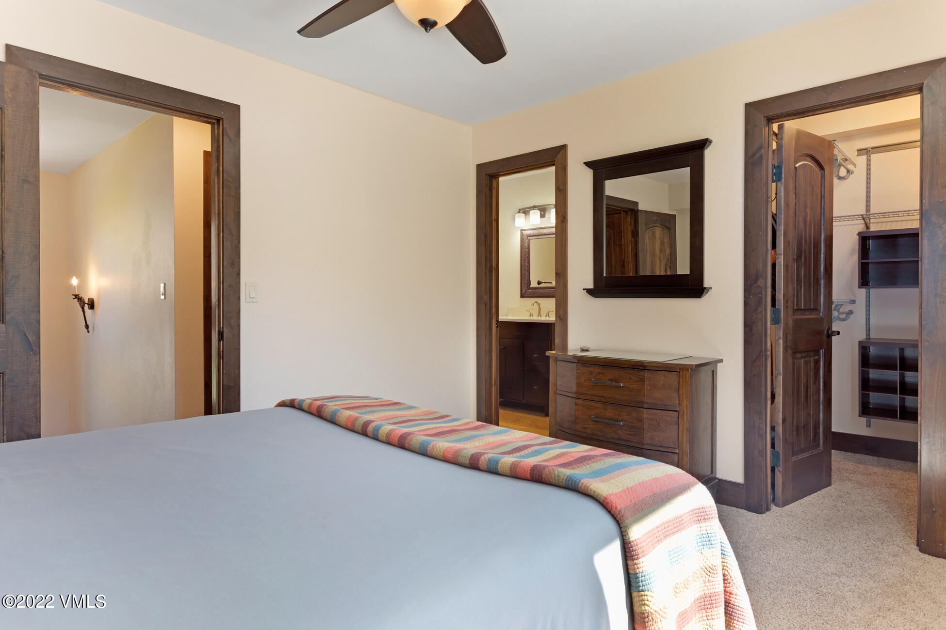 132 Eagle Road, Unit B Avon, CO 81620 - Photo 20 of 38 a bedroom with a bed and a dresser