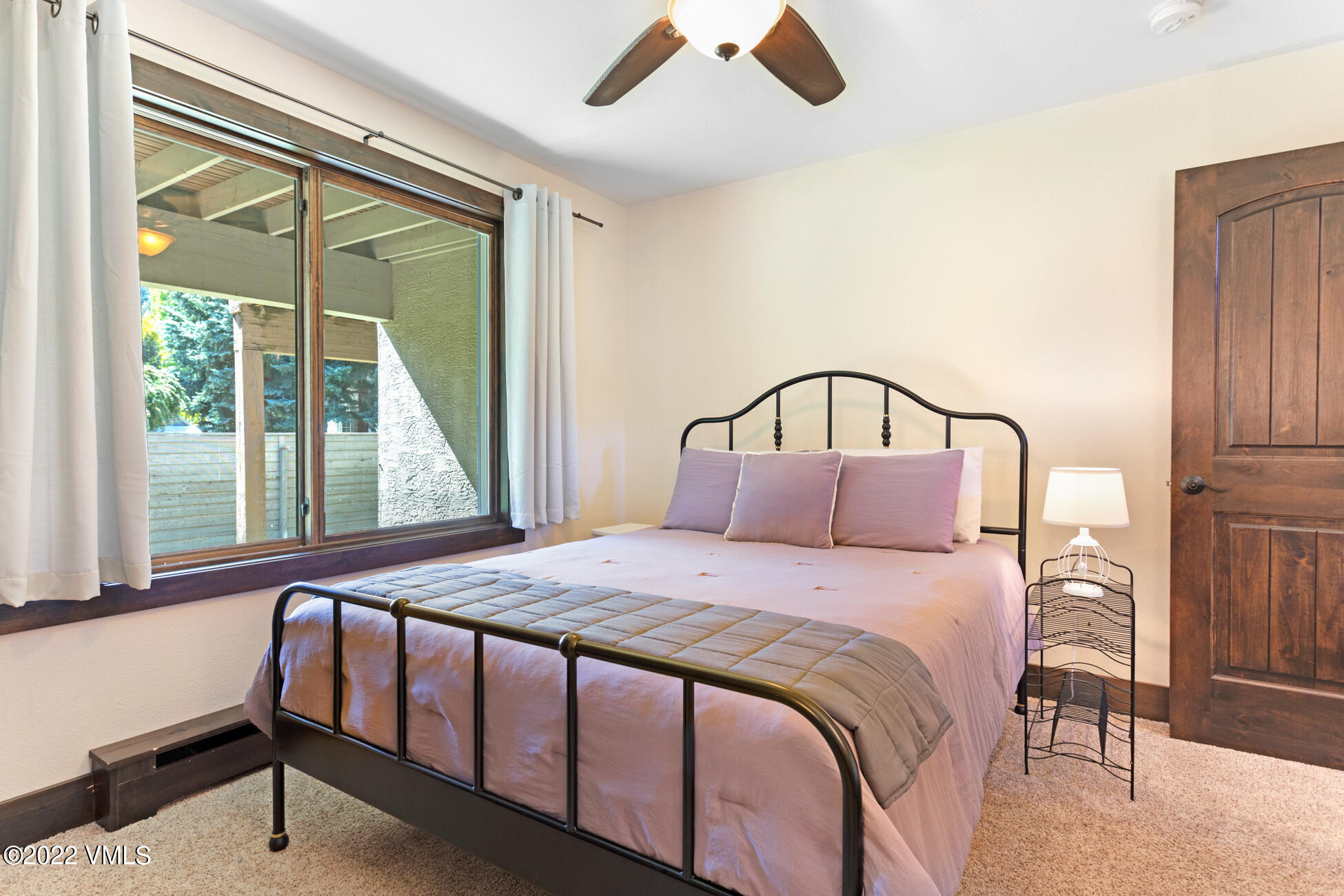 132 Eagle Road, Unit B Avon, CO 81620 - Photo 26 of 38 a bedroom with a large bed and a window