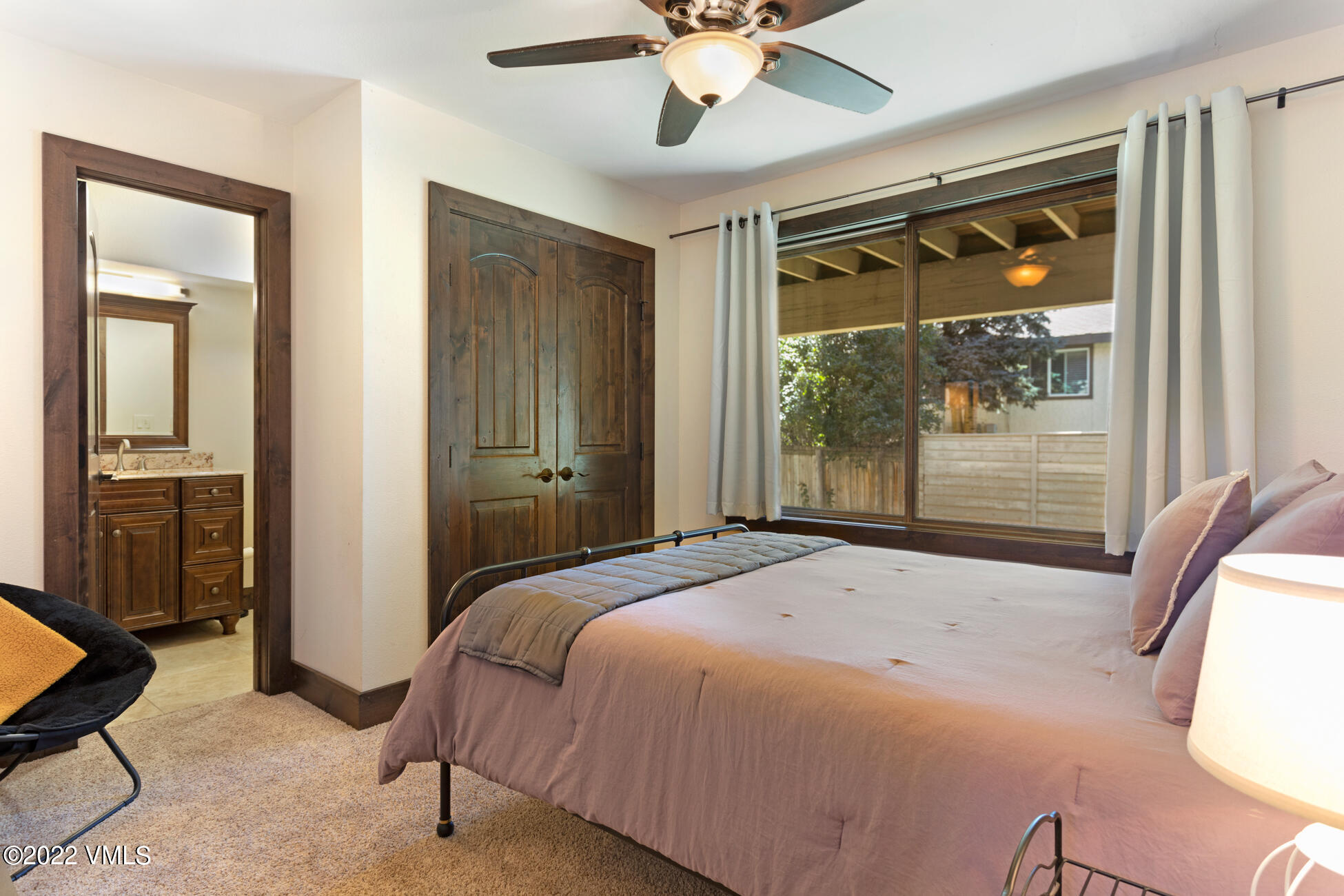 132 Eagle Road, Unit B Avon, CO 81620 - Photo 27 of 38 a bedroom with a large bed and a window