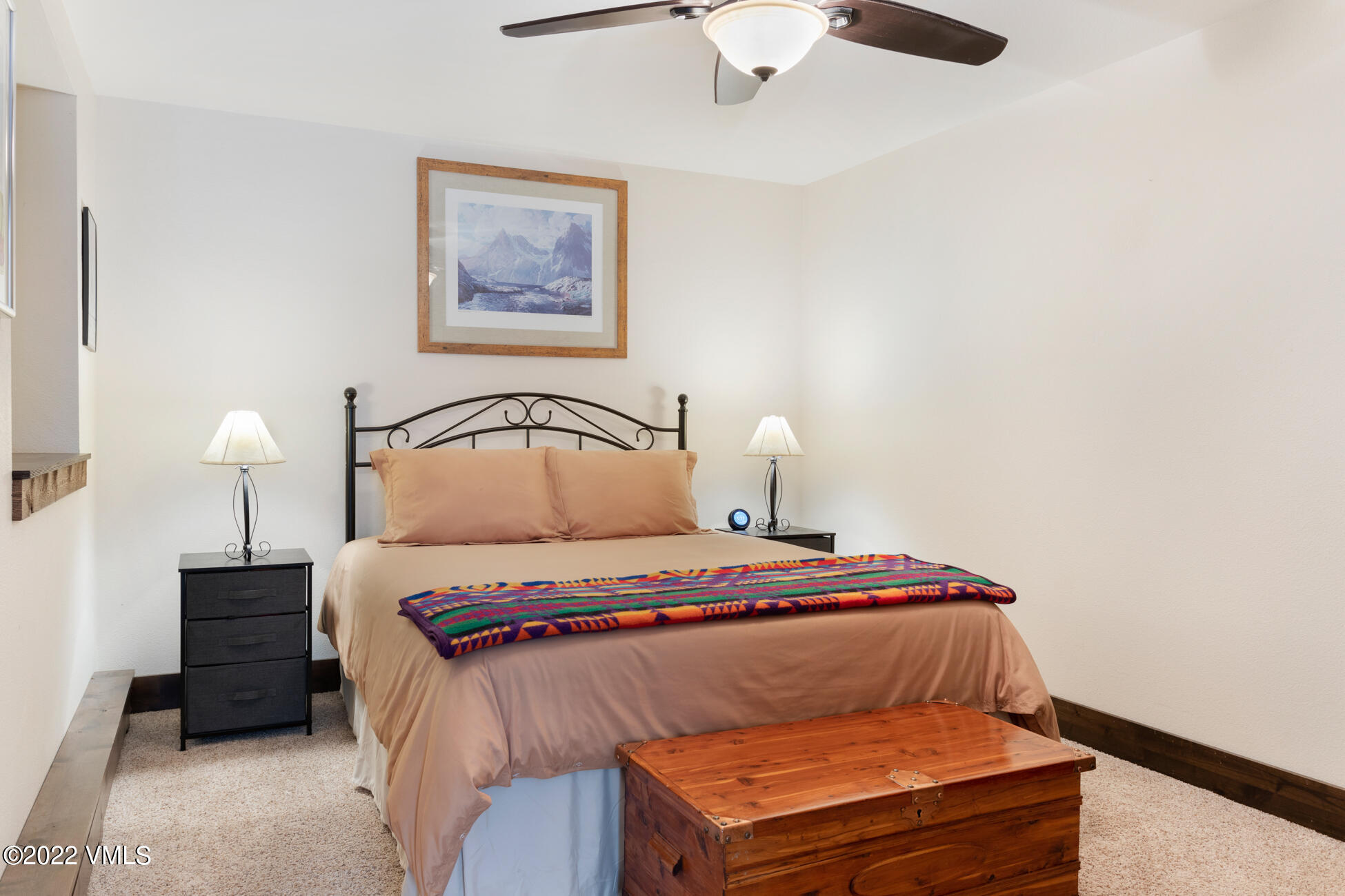 132 Eagle Road, Unit B Avon, CO 81620 - Photo 36 of 38 a bedroom with a bed and a lamp on table