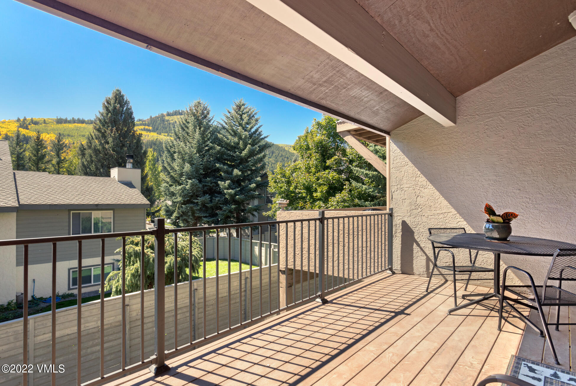 132 Eagle Road, Unit B Avon, CO 81620 - Photo 6 of 38 a view of a balcony with wooden floor and outdoor seating