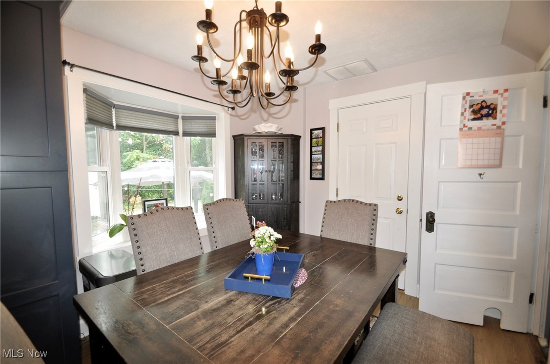 467 Cahoon Road Bay Village, OH 44140 - Photo 12 of 41 Dining room with a chandelier and dark wood finished floors