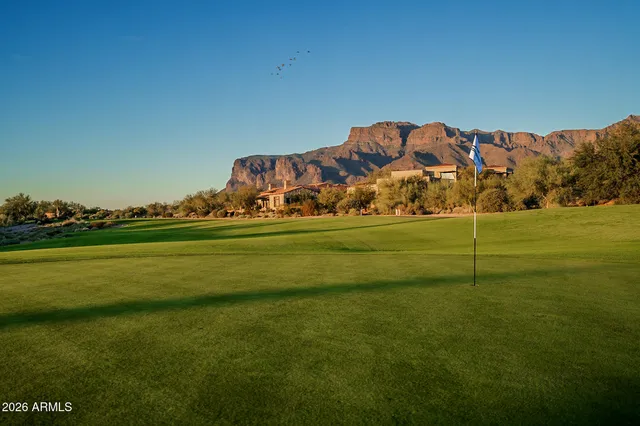 a view of a golf course with a lake
