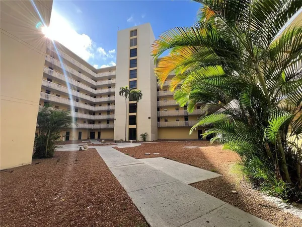 a view of a building with backyard