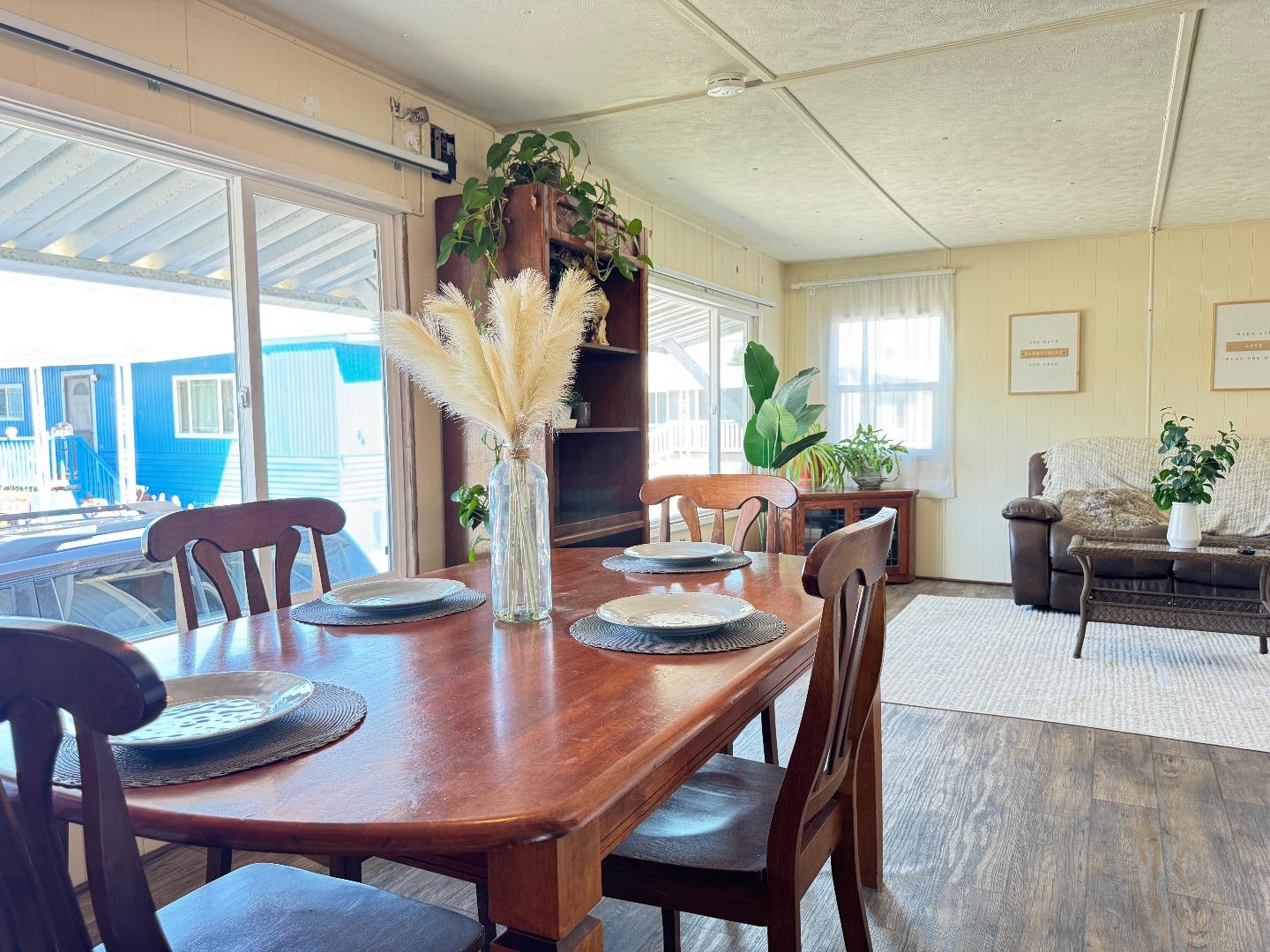 55 San Juan Grade Road, Unit 79 Salinas, CA 93906 - Photo 8 of 22 a view of a dining room with furniture window and wooden floor