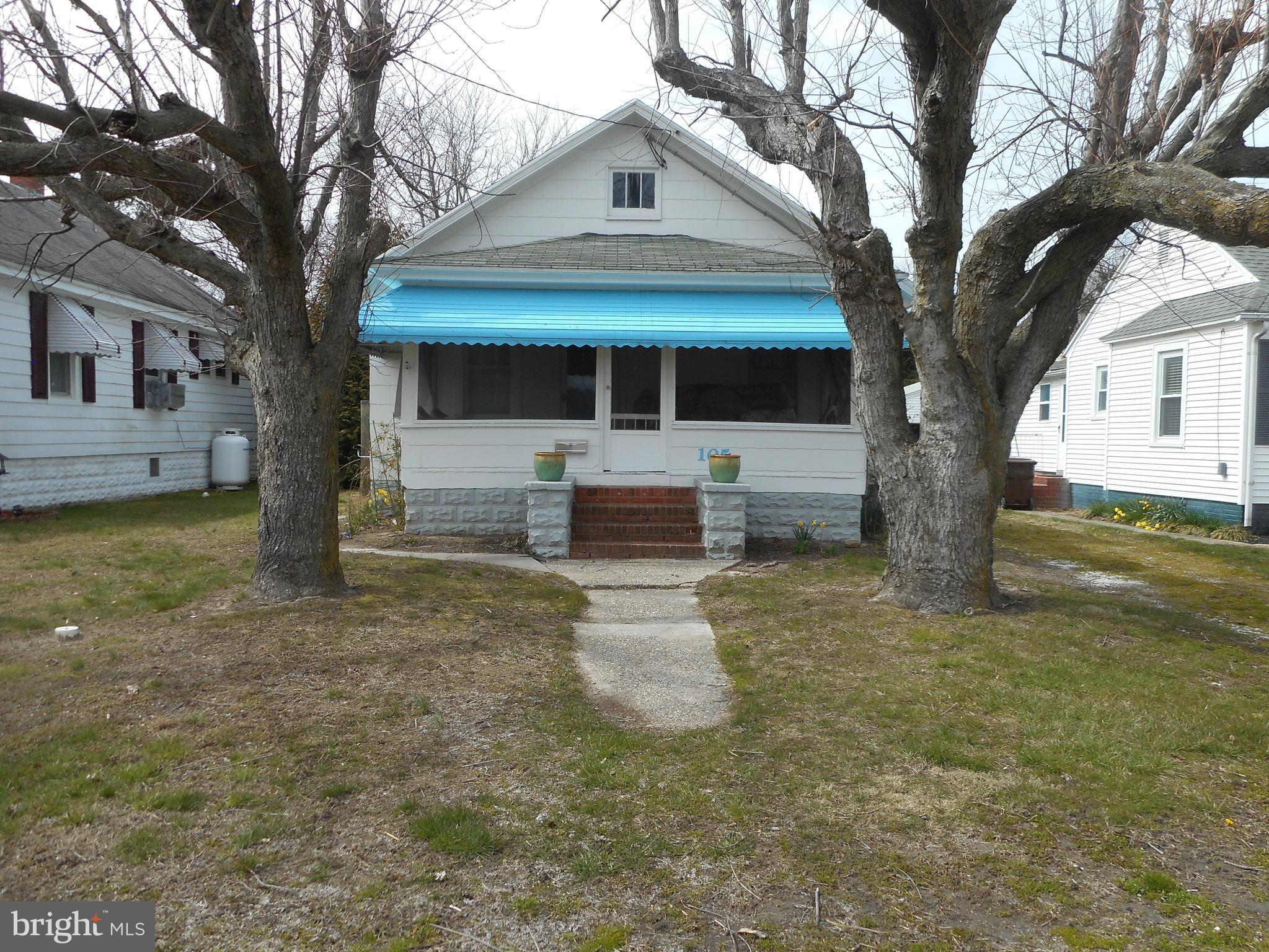 105 Hiawatha Road Cambridge, MD 21613 - Photo 1 of 15 a front view of a house with a yard