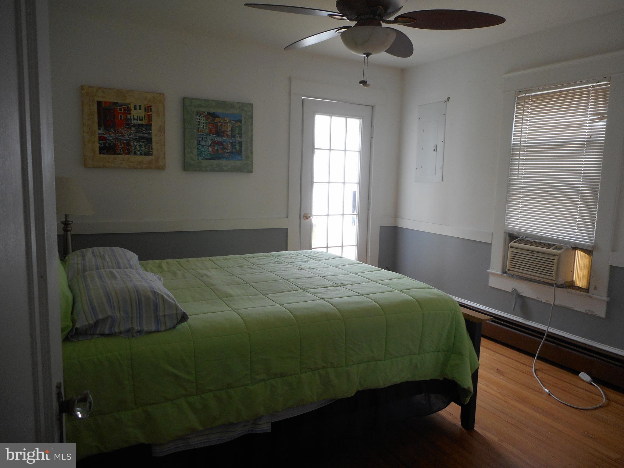 105 Hiawatha Road Cambridge, MD 21613 - Photo 7 of 15 a bedroom with a bed and a window