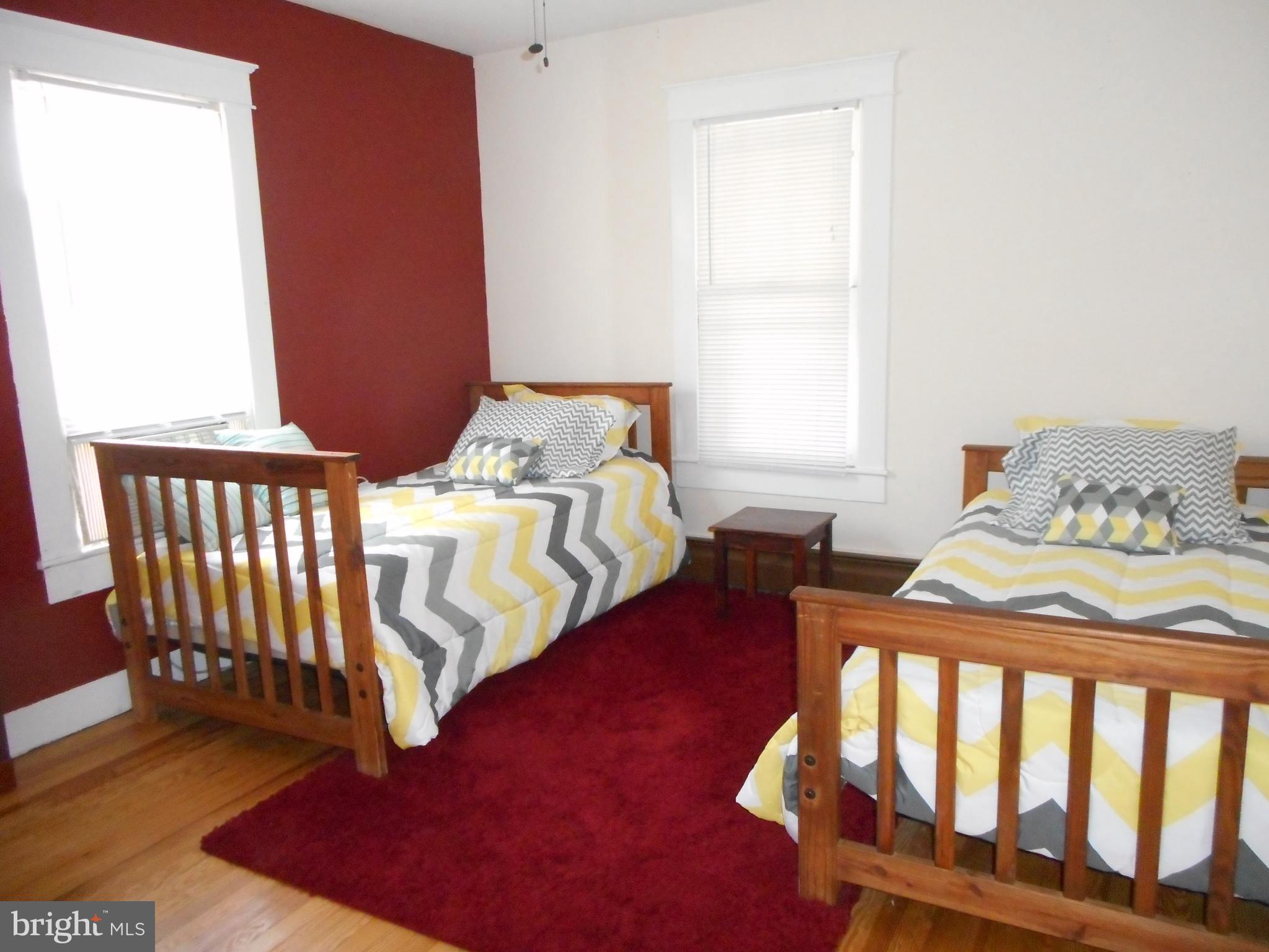 105 Hiawatha Road Cambridge, MD 21613 - Photo 8 of 15 a bedroom with furniture and a window