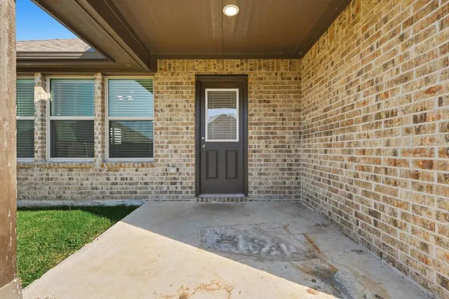 a view of house with backyard of the house