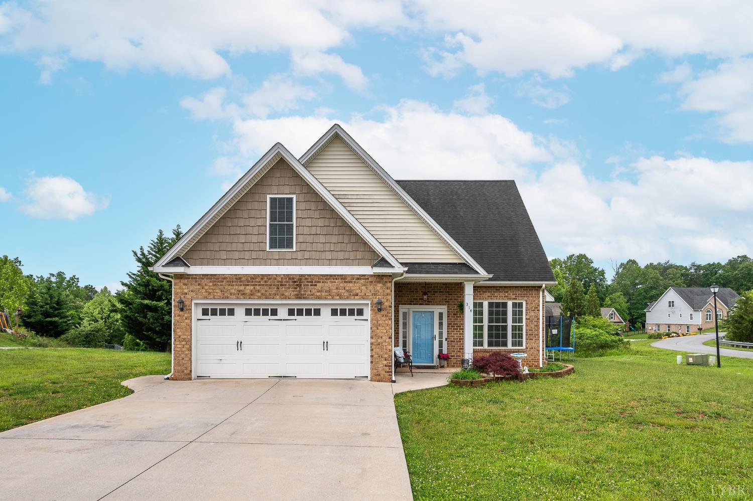 314 Cooper Way Evington, VA 24550 - Photo 1 of 44 a view of a house with garden