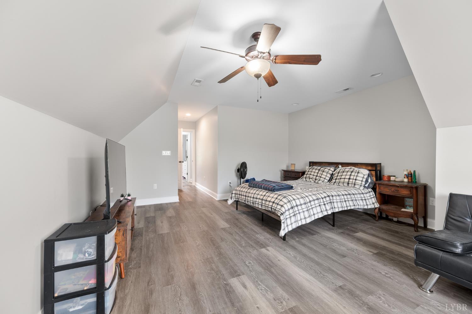 314 Cooper Way Evington, VA 24550 - Photo 38 of 44 a bedroom with furniture and wooden floor