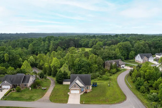an aerial view of a house with outdoor space