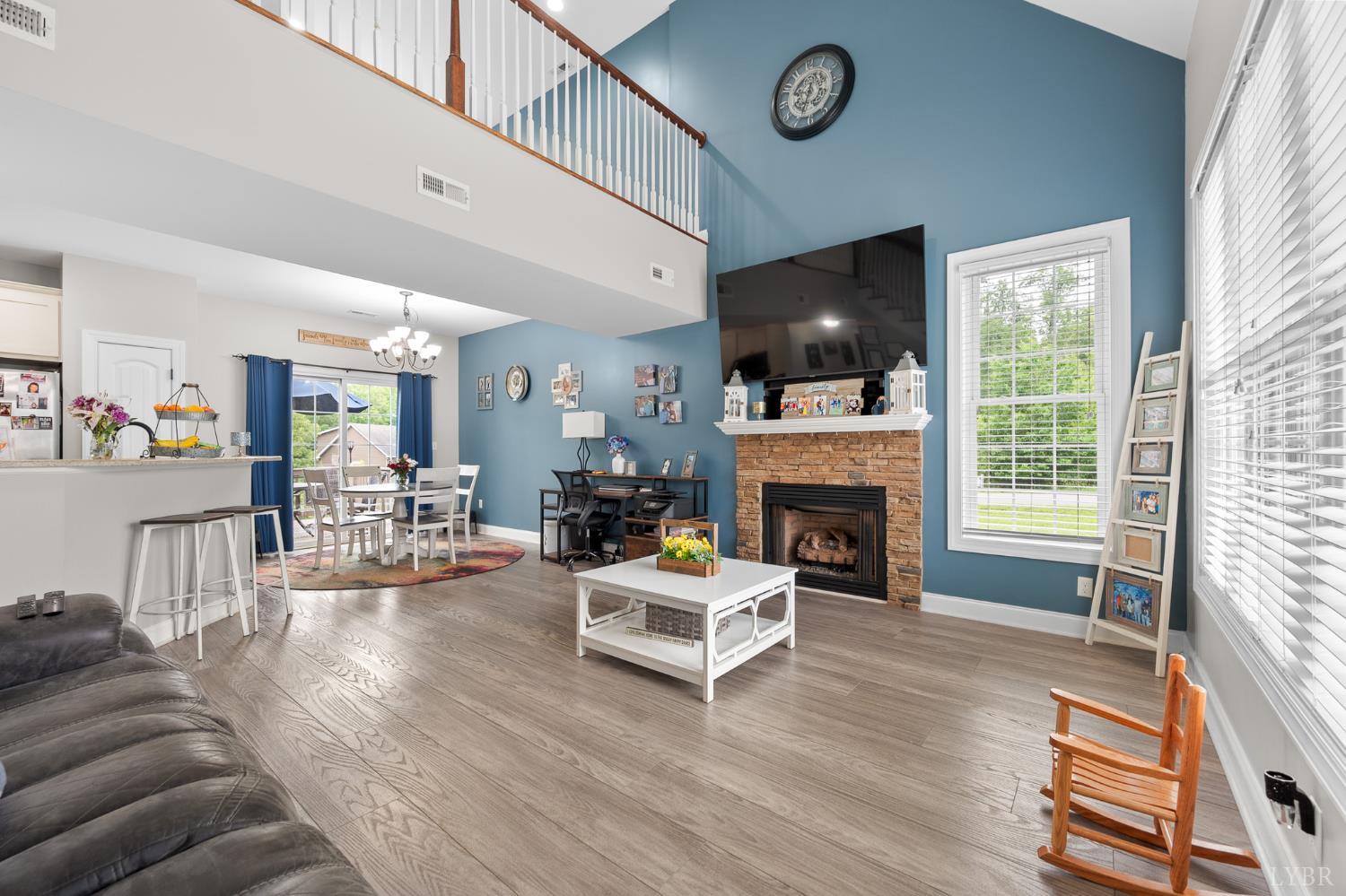 314 Cooper Way Evington, VA 24550 - Photo 8 of 44 a living room with furniture a flat screen tv and a fireplace