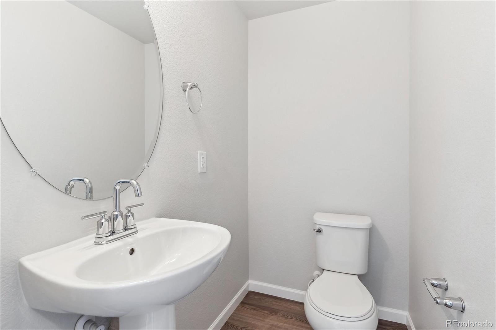 453 Interlocken Boulevard, Unit 103 Broomfield, CO 80021 - Photo 6 of 15 a white toilet sitting next to a white sink