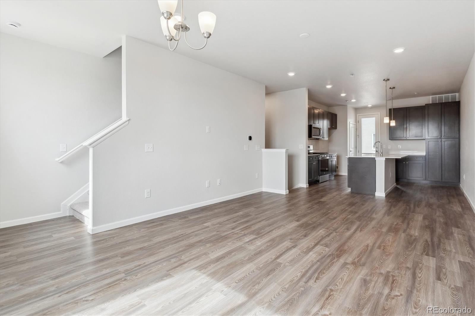 453 Interlocken Boulevard, Unit 103 Broomfield, CO 80021 - Photo 7 of 15 a view of a kitchen with a sink and a refrigerator