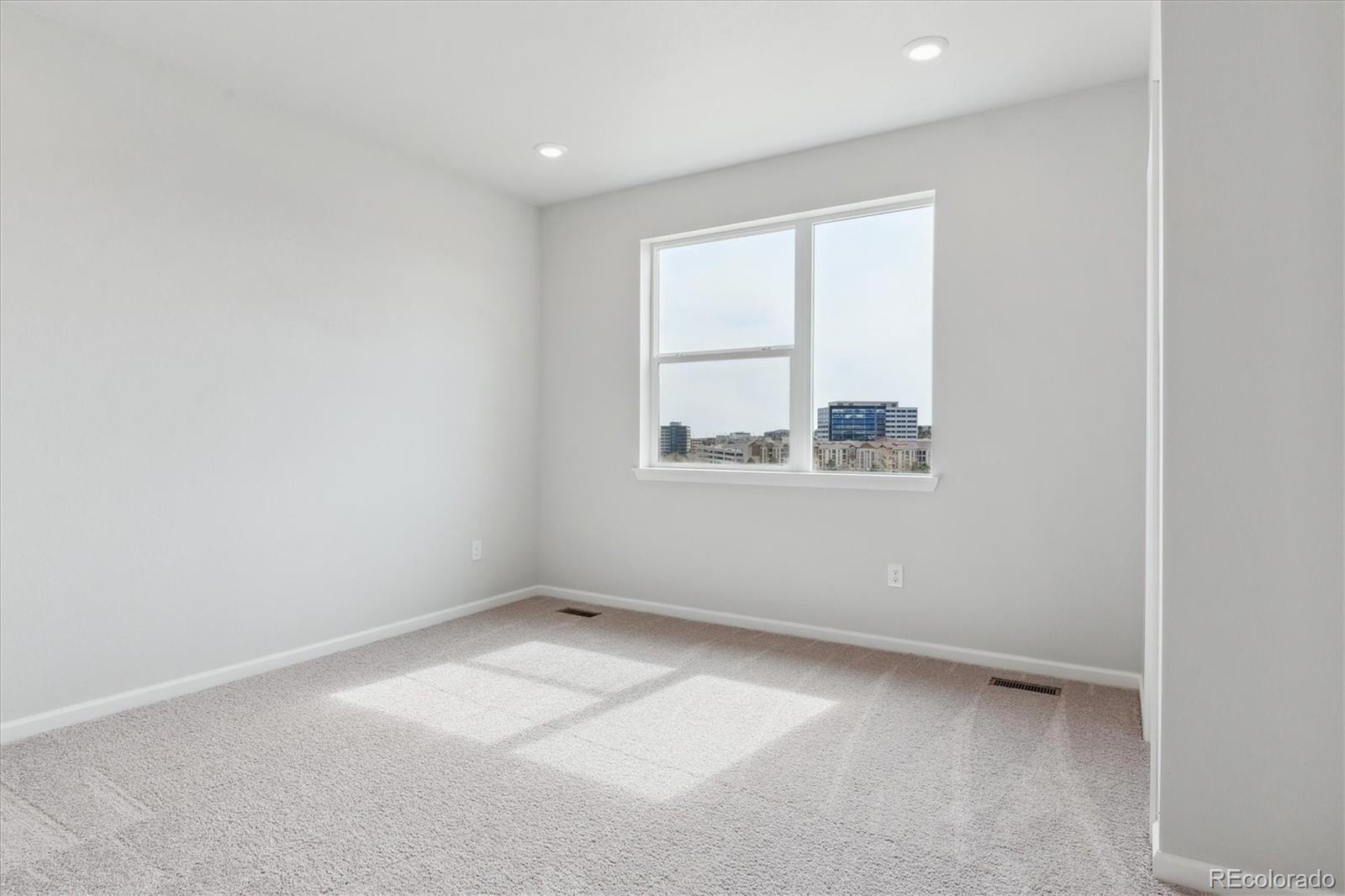453 Interlocken Boulevard, Unit 103 Broomfield, CO 80021 - Photo 8 of 15 an empty room with a window