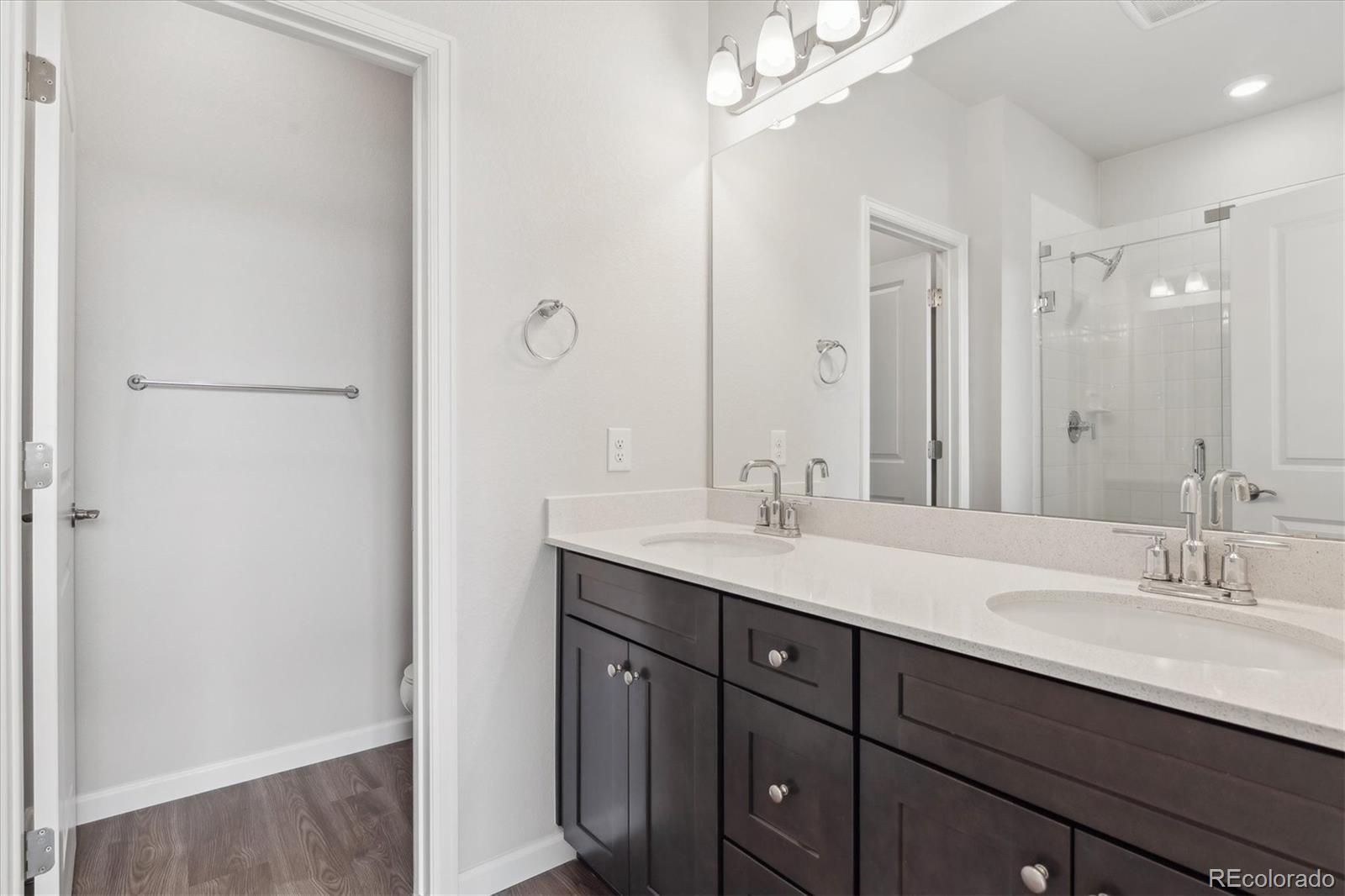 453 Interlocken Boulevard, Unit 103 Broomfield, CO 80021 - Photo 10 of 15 a bathroom with a sink double vanity and a mirror