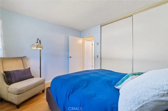 a bedroom with a bed window and a couch