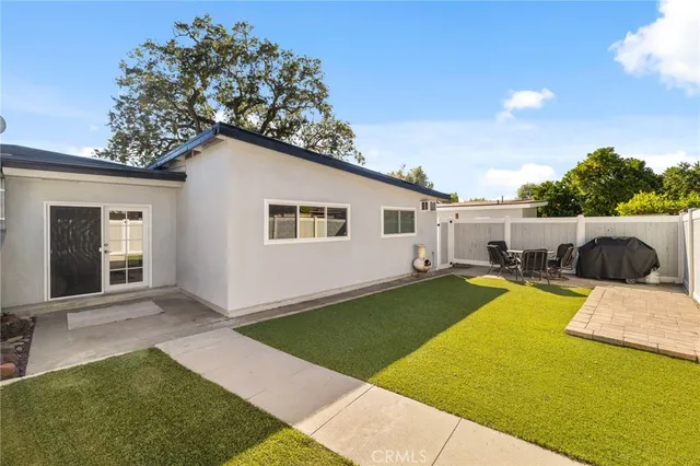 a view of a backyard with swimming pool
