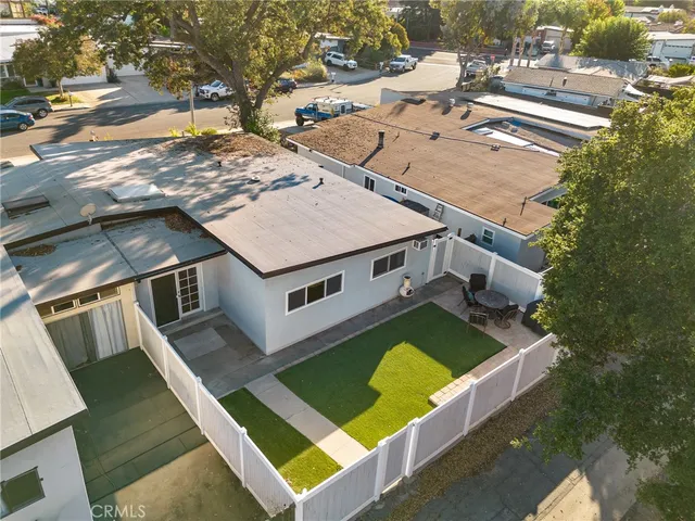 an aerial view of a house with a swimming pool