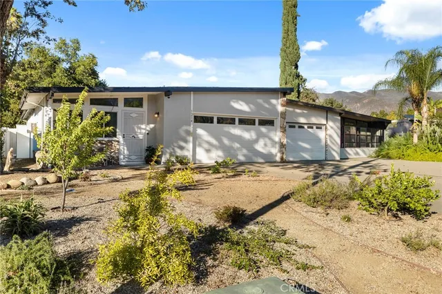 a view of a house with snow on the ground