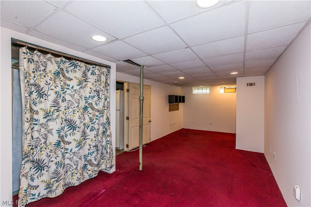 6203 Snow Road Parma, OH 44129 - Photo 22 of 29 Basement with carpet floors and a drop ceiling